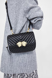 CROSSBODY BELT BAG WITH LION DETAILS